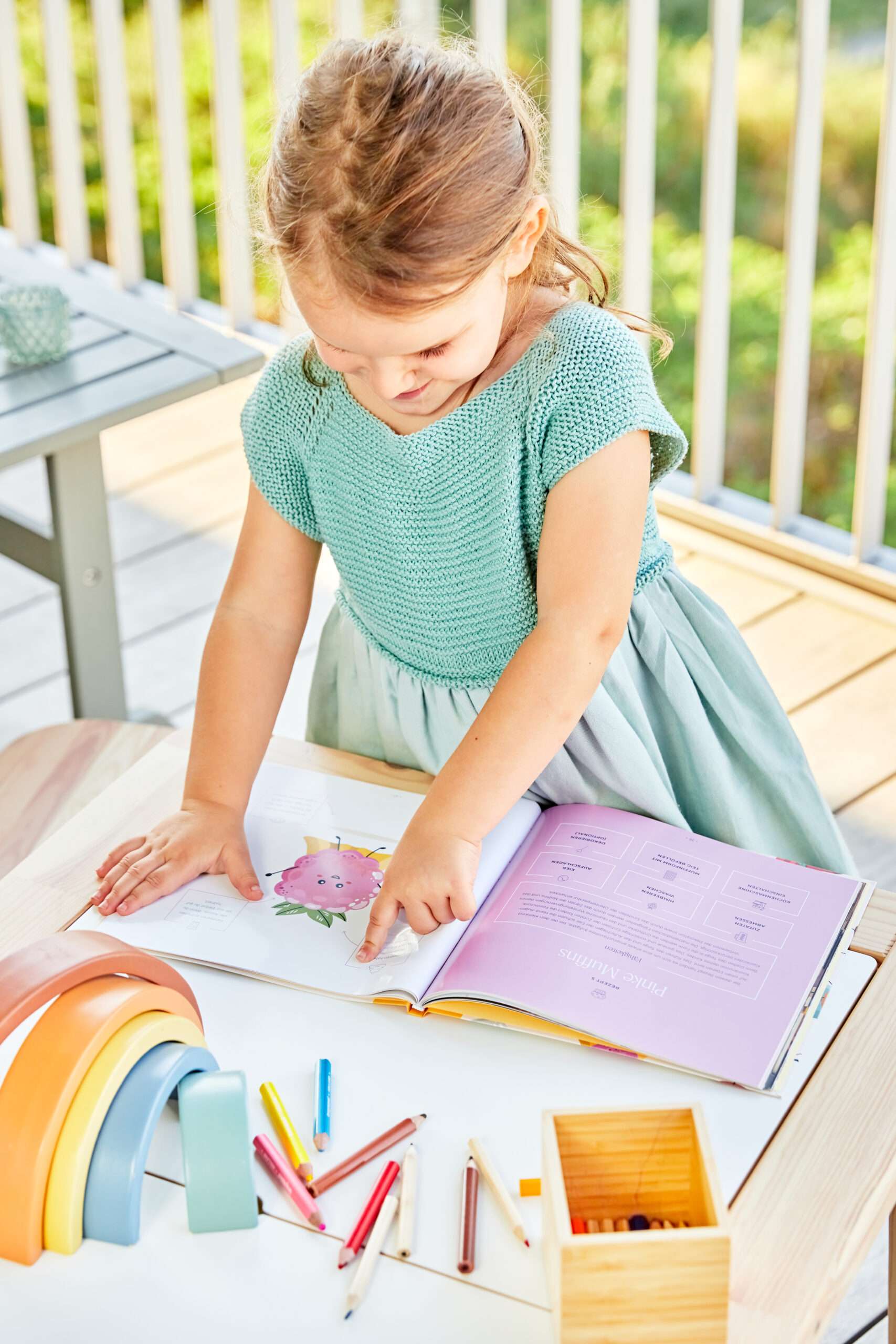 Little girl choosing easy and creative recipes